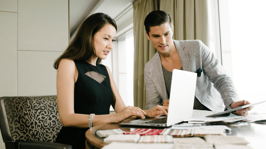 Couple looking at a computer making decision